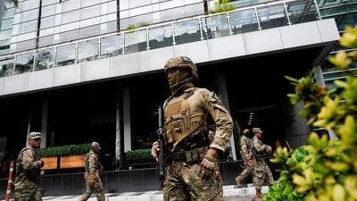 Members of Panama's National Aeronaval Service police stand outside the hotel where migrants from Asia and the Middle East are housed after being deported to Panama as part of an agreement between the Trump administration and the Central American nation (REUTERS) Members of Panama's National Aeronaval Service police stand outside the hotel where migrants from Asia and the Middle East are housed after being deported to Panama as part of an agreement between the Trump administration and the Central American nation (REUTERS)