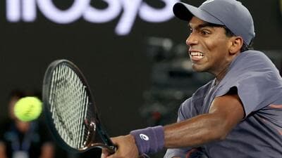 Nishesh Basavareddy hits a return against Serbia's Novak Djokovic during Australian Open. (AFP) Nishesh Basavareddy hits a return against Serbia's Novak Djokovic during Australian Open. (AFP)