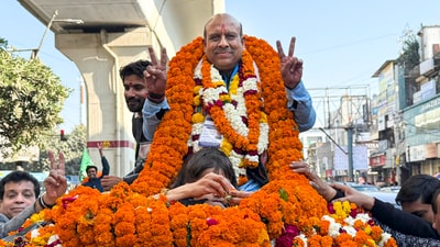 BJP leader Vijender Gupta celebrates after winning in the Delhi assembly poll (PTI) BJP leader Vijender Gupta celebrates after winning in the Delhi assembly poll (PTI)