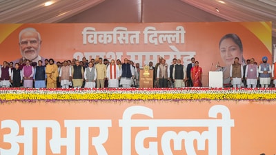 Prime Minister Narendra Modi and other dignitaries with newly sworn-in Delhi Chief Minister Rekha Gupta and other ministers during the oath ceremony, in New Delhi, Thursday, Feb. 20, 2025. (PTI) Prime Minister Narendra Modi and other dignitaries with newly sworn-in Delhi Chief Minister Rekha Gupta and other ministers during the oath ceremony, in New Delhi, Thursday, Feb. 20, 2025. (PTI)