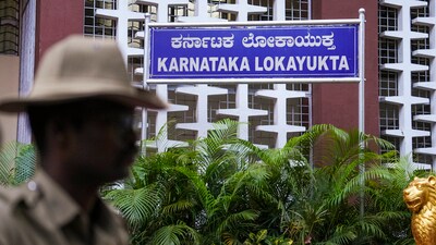 A policeman stands guard at the Lokayukta office, in Bengaluru, (PTI) A policeman stands guard at the Lokayukta office, in Bengaluru, (PTI)