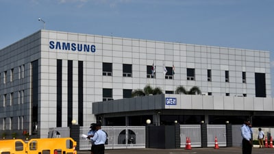 Security guards stand outside a Samsung facility during a strike by the factory workers demanding higher wages in Sriperumbudur, near the city of Chennai, India, September 16, 2024. (Reuters)