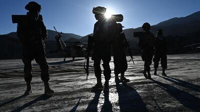 Taliban security personnel stand guard as a helicopter prepares to take off after the funeral ceremony of Khalil Ur-Rahman Haqqani, the Minister for Refugees and Repatriation, in Sarana of Paktia province, south of Kabul, on December 12, 2024. (AFP FILE PHOTO) Taliban security personnel stand guard as a helicopter prepares to take off after the funeral ceremony of Khalil Ur-Rahman Haqqani, the Minister for Refugees and Repatriation, in Sarana of Paktia province, south of Kabul, on December 12, 2024. (AFP FILE PHOTO)