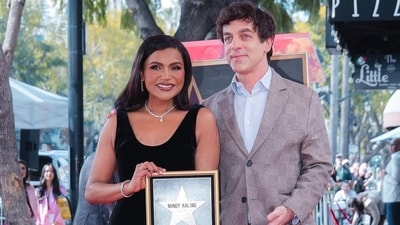 Mindy Kaling poses with BJ Novak on the Hollywood Walk of Fame. Mindy Kaling poses with BJ Novak on the Hollywood Walk of Fame.