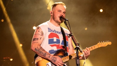 Country star Zach Bryan was filmed using a homophobic slur during a confrontation at a NYC bar, escalating after he lost a pool game.
(Photo by Amy Harris/Invision/AP) (Amy Harris/Invision/AP) Country star Zach Bryan was filmed using a homophobic slur during a confrontation at a NYC bar, escalating after he lost a pool game.
(Photo by Amy Harris/Invision/AP) (Amy Harris/Invision/AP)