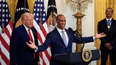 Housing and Urban Development Secretary Scott Turner speaks as President Donald Trump and Tiger Woods listen during a reception for Black History Month in the East Room of the White House Thursday, Feb. 20, 2025. AP/PTI(AP02_21_2025_000007B) (AP) Housing and Urban Development Secretary Scott Turner speaks as President Donald Trump and Tiger Woods listen during a reception for Black History Month in the East Room of the White House Thursday, Feb. 20, 2025. AP/PTI(AP02_21_2025_000007B) (AP)
