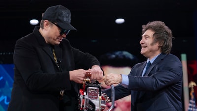 Elon Musk, left, receives a chainsaw from Argentina's President Javier Milei at the Conservative Political Action Conference, CPAC, at the Gaylord National Resort & Convention Center, Thursday, Feb. 20, 2025, in Oxon Hill, Md. (AP Photo/Jose Luis Magana) Elon Musk, left, receives a chainsaw from Argentina's President Javier Milei at the Conservative Political Action Conference, CPAC, at the Gaylord National Resort & Convention Center, Thursday, Feb. 20, 2025, in Oxon Hill, Md. (AP Photo/Jose Luis Magana)