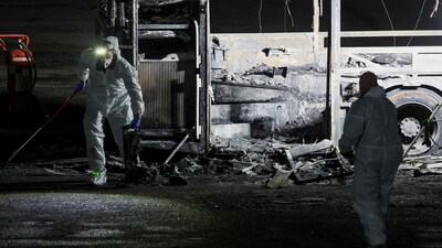 Forensic personnel inspect a bus following its explosion in Bat Yam, south of Tel Aviv, Israel (REUTERS/Nir Elias)