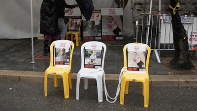 A poster shows slain hostages Oded Lifshitz, left, Ariel Bibas, center, and Kfir Bibas, right, whose bodies were released from the Gaza Strip, in Jerusalem, Friday, Feb. 21, 2025. (AP Photo/Mahmoud Illean) (AP) A poster shows slain hostages Oded Lifshitz, left, Ariel Bibas, center, and Kfir Bibas, right, whose bodies were released from the Gaza Strip, in Jerusalem, Friday, Feb. 21, 2025. (AP Photo/Mahmoud Illean) (AP)