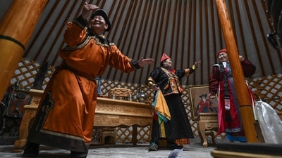 People in traditional Mongolian costumes dance inside a Ger (Mongolian tent) during the Mongols Nomadic Winter Festival at National Park in Ulaanbaatar, the capital of Mongolia. (Photo by JADE GAO / AFP) People in traditional Mongolian costumes dance inside a Ger (Mongolian tent) during the Mongols Nomadic Winter Festival at National Park in Ulaanbaatar, the capital of Mongolia. (Photo by JADE GAO / AFP)