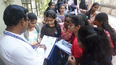 Officials verify the admit cards of students before admitting them for the Maharashtra Class 10 Board Exam in Thane ( Praful Gangurde) Officials verify the admit cards of students before admitting them for the Maharashtra Class 10 Board Exam in Thane ( Praful Gangurde)