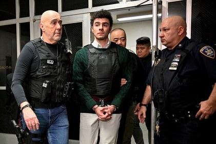 Luigi Mangione, center, arrives for a pretrial hearing at New York State Supreme Court in New York, US, on Friday, Feb. 21, 2025. Mangione, the Ivy League graduate charged with fatally shooting UnitedHealth Group Inc. executive Brian Thompson in December on a Manhattan sidewalk, was back in court on Friday. Photographer: Curtis Means/Daily Mail/Bloomberg (Bloomberg) Luigi Mangione, center, arrives for a pretrial hearing at New York State Supreme Court in New York, US, on Friday, Feb. 21, 2025. Mangione, the Ivy League graduate charged with fatally shooting UnitedHealth Group Inc. executive Brian Thompson in December on a Manhattan sidewalk, was back in court on Friday. Photographer: Curtis Means/Daily Mail/Bloomberg (Bloomberg)