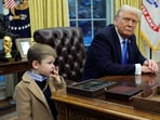 US President Donald Trump looks on as X Æ A-12, Elon Musk's son, stands beside him in the Oval Office of the White House in Washington, DC, on February 11, 2025.