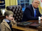 FILE PHOTO: U.S. President Donald Trump looks on as X Æ A-12, Elon Musk's son, stands beside him in the Oval Office of the White House in Washington, D.C., U.S., February 11, 2025.   REUTERS/Kevin Lamarque/File Photo