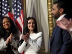 Alexis Wilkins (middle) accompanied her boyfriend and new FBI director Kash Patel to his swearing-in ceremony on Friday. 
