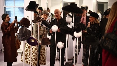 British milliner Stephen Jones (C) speaks with a visitor as he presents his Autumn-Winter 2025-2026 collection in his Covent Garden shop during London Fashion Week in London, on February 21, 2025. (AFP) British milliner Stephen Jones (C) speaks with a visitor as he presents his Autumn-Winter 2025-2026 collection in his Covent Garden shop during London Fashion Week in London, on February 21, 2025. (AFP)