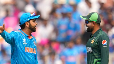 India's captain Rohit Sharma, left and Pakistan's Babar Azam talk before a match. (AP) India's captain Rohit Sharma, left and Pakistan's Babar Azam talk before a match. (AP)