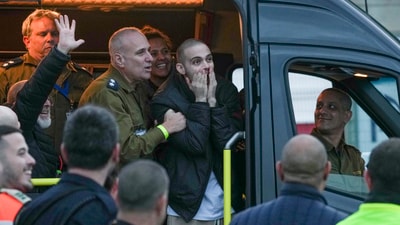 Freed Israeli hostage Omer Wenkert, gestures from a van as he arrives at Beilinson hospital in Petah Tikva, Israel, after he was released from Hamas captivity in the Gaza Strip, Saturday. (AP) Freed Israeli hostage Omer Wenkert, gestures from a van as he arrives at Beilinson hospital in Petah Tikva, Israel, after he was released from Hamas captivity in the Gaza Strip, Saturday. (AP)