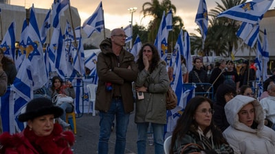 People gather at a vigil in Tel Aviv, Israel, hours after Hamas militants turned over four bodies to Israel, three of which have been identified by Israel as hostages Ariel and Kfir Bibas, and Oded Lifshitz, while the fourth, they said, is that of an unknown person. (AP/Ohad Zwigenberg) People gather at a vigil in Tel Aviv, Israel, hours after Hamas militants turned over four bodies to Israel, three of which have been identified by Israel as hostages Ariel and Kfir Bibas, and Oded Lifshitz, while the fourth, they said, is that of an unknown person. (AP/Ohad Zwigenberg)