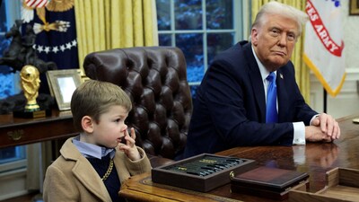 FILE PHOTO: U.S. President Donald Trump looks on as X Æ A-12, Elon Musk's son, stands beside him in the Oval Office of the White House in Washington, D.C., U.S., February 11, 2025.   REUTERS/Kevin Lamarque/File Photo (REUTERS)