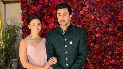 Alia Bhatt opted for a pink saree and matching blouse. Ranbir Kapoor wore a black bandhgala and trousers. Alia Bhatt opted for a pink saree and matching blouse. Ranbir Kapoor wore a black bandhgala and trousers.