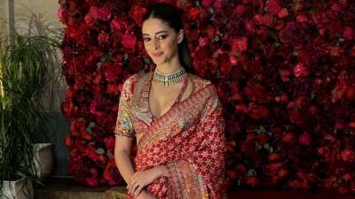 Ananya Panday attended the event wearing a red, green and golden saree. Ananya Panday attended the event wearing a red, green and golden saree.