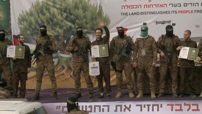 Omer Shem Tov, Eliya Cohen and Omer Wenkert, hostages held in Gaza since the deadly October 7, 2023 attack, are released as part of a ceasefire and a hostages-prisoners swap deal between Hamas and Israel, in Nuseirat, central Gaza Strip on February 22. (Reuters)
