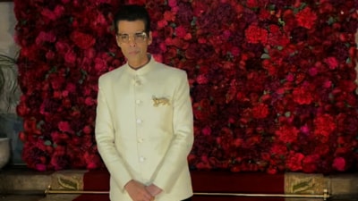 Karan Johar was seen at the event wearing a cream bandhgala and matching trousers. Karan Johar was seen at the event wearing a cream bandhgala and matching trousers.