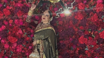 Rekha arrived at the event dressed in a red and black saree and red blouse. She also opted for heavy traditional jewellery. Rekha arrived at the event dressed in a red and black saree and red blouse. She also opted for heavy traditional jewellery.