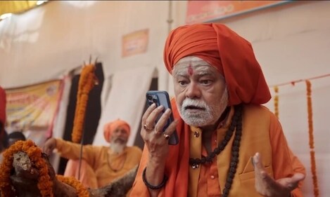 Sanjay Mishra in a still from the UP Police film on cyber crime shot during the ongoing Maha Kumbh Mela in Prayagraj Sanjay Mishra in a still from the UP Police film on cyber crime shot during the ongoing Maha Kumbh Mela in Prayagraj