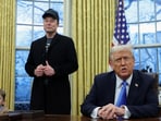 US President Donald Trump speaks next to Elon Musk and X Æ A-12, Musk's son, in the Oval Office of the White House in Washington.