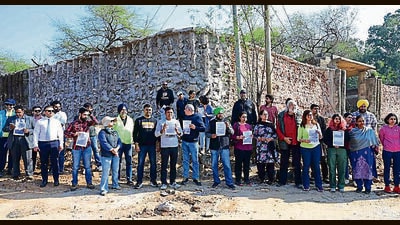 City residents protesting against the demolition of a Rock Garden wall by the administration in Chandigarh on Sunday. (Keshav Singh/HT) City residents protesting against the demolition of a Rock Garden wall by the administration in Chandigarh on Sunday. (Keshav Singh/HT)
