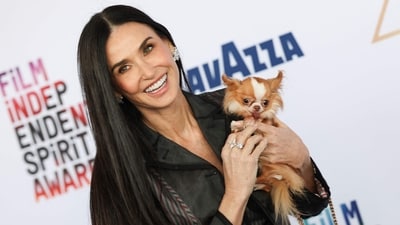 Demi Moore embraced sheer trend in a custom Thom Browne look consisting of a black sheer midi dress and blazer. She accessorised with diamond-encrusted earrings and rings, as well as her pooch, Pilaf. (AFP) Demi Moore embraced sheer trend in a custom Thom Browne look consisting of a black sheer midi dress and blazer. She accessorised with diamond-encrusted earrings and rings, as well as her pooch, Pilaf. (AFP)