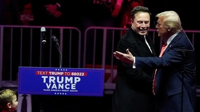 U.S. President-elect Donald Trump greets Tesla CEO and X owner Elon Musk during a rally the day before Trump is scheduled to be inaugurated for a second term, in Washington, U.S., January 19, 2025. (REUTERS)