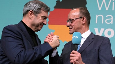 Friedrich Merz, right, leader of the Christian Democratic Union (CDU), and Markus Soeder, leader of the Christian Social Union (CSU), shake hands at the CDU party headquarters in Berlin. (AP) Friedrich Merz, right, leader of the Christian Democratic Union (CDU), and Markus Soeder, leader of the Christian Social Union (CSU), shake hands at the CDU party headquarters in Berlin. (AP)