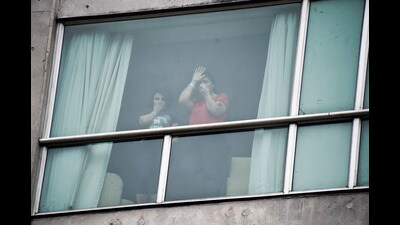 Migrants deported from the United States wave to the press from inside a hotel in Panama City, Wednesday, Feb. 19, 2025. (AP) Migrants deported from the United States wave to the press from inside a hotel in Panama City, Wednesday, Feb. 19, 2025. (AP)