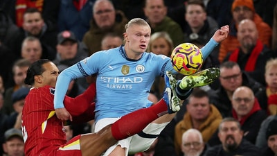 Liverpool's Virgil van Dijk in action with Manchester City's Erling Haaland. (REUTERS)