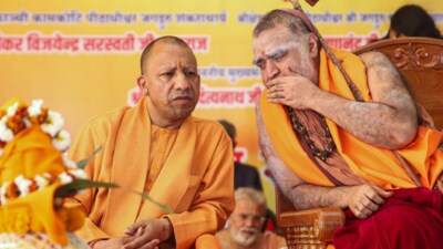 UP CM Yogi Adityanath with Shankaracharya of Kanchi Kamakoti Peetham Jagadguru Shankara Vijayendra Saraswati Swamigal during Maha Kumbh Mela Mahotsav program at Maha Kumbh Mela 2025 in Prayagraj, Sunday, Feb. 23. (PTI) UP CM Yogi Adityanath with Shankaracharya of Kanchi Kamakoti Peetham Jagadguru Shankara Vijayendra Saraswati Swamigal during Maha Kumbh Mela Mahotsav program at Maha Kumbh Mela 2025 in Prayagraj, Sunday, Feb. 23. (PTI)