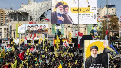 Mourners walk during the funeral procession with the vehicle carrying the coffins of Hezbollah's slain leaders Hassan Nasrallah and Hashem Safieddine from the Camille Chamoun Sports City Stadium towards the burial place on the outskirts of Beirut on February 23, 2025. (AFP) Mourners walk during the funeral procession with the vehicle carrying the coffins of Hezbollah's slain leaders Hassan Nasrallah and Hashem Safieddine from the Camille Chamoun Sports City Stadium towards the burial place on the outskirts of Beirut on February 23, 2025. (AFP)