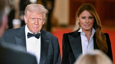 First Lady Melania Trump and President Donald Trump arrive for the National Governors Association Evening Dinner and Reception in the East Room of the White House in Washington, DC, on February 22, 2025. (Photo by ROBERTO SCHMIDT / AFP) (AFP)