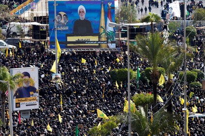 Lebanon's Hezbollah leader Sheikh Naim Qassem appears on a screen as people gather to watch the public funeral ceremony of Hezbollah leaders Hassan Nasrallah and Hashem Safieddine, who were killed in Israeli airstrikes last year, on the outskirts of Beirut, Lebanon February 23, 2025. REUTERS/Ali Allouch (REUTERS)