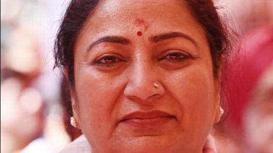 Delhi chief minister Rekha Gupta listens to Prime Minister Narendra Modi’s "Mann Ki Baat" programme at Sanatan Dharm Mandir Park at Narayana Vihar in New Delhi on Sunday. (Vipin Kumar/HT Photo)