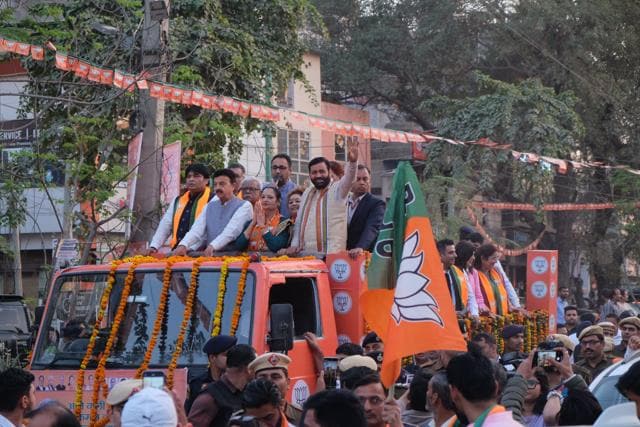 Haryana chief minister Nayab Singh Saini, with BJP’s mayoral candidate Raj Rani Malhotra during a road show in Sadar Bazar on Sunday. (Parveen Kumar/HT Photo) Haryana chief minister Nayab Singh Saini, with BJP’s mayoral candidate Raj Rani Malhotra during a road show in Sadar Bazar on Sunday. (Parveen Kumar/HT Photo)