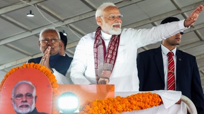 Prime Minister Narendra Modi waves to the gathering on his arrival to release the 19th instalment of the PM Kisan Samman Nidhi Yojana, in Bhagalpur on Monday. Bihar Chief Minister Nitish Kumar also present. (DPR PMO/ANI) Prime Minister Narendra Modi waves to the gathering on his arrival to release the 19th instalment of the PM Kisan Samman Nidhi Yojana, in Bhagalpur on Monday. Bihar Chief Minister Nitish Kumar also present. (DPR PMO/ANI)