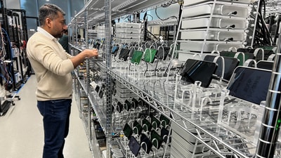 An Apple engineer stress tests an iPhone 16e and the new C1 cellular modem at an Apple lab in Sunnyvale, California. (REUTERS)