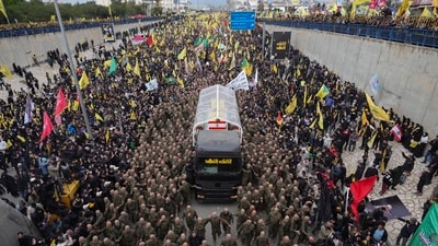 After the funeral ceremony, people joined a procession outside the stadium before burying Nasrallah nearby. A Lebanese security source estimated the crowd at about a million people. (AP) After the funeral ceremony, people joined a procession outside the stadium before burying Nasrallah nearby. A Lebanese security source estimated the crowd at about a million people. (AP)