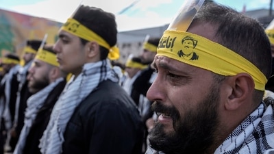 A Hezbollah supporter reacts during the funeral procession of Hassan Nasrallah and his cousin and successor, Hashem Safieddine, at Nasrallah's burial site in Beirut's southern suburbs, Lebanon on Sunday. (AP) A Hezbollah supporter reacts during the funeral procession of Hassan Nasrallah and his cousin and successor, Hashem Safieddine, at Nasrallah's burial site in Beirut's southern suburbs, Lebanon on Sunday. (AP)