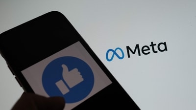 This illustration photo taken in Los Angeles on October 28, 2021, shows a person using Facebook on a smartphone in front of a computer screen showing the META logo. (Chris Delmas/AFP) This illustration photo taken in Los Angeles on October 28, 2021, shows a person using Facebook on a smartphone in front of a computer screen showing the META logo. (Chris Delmas/AFP)