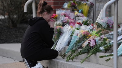 Pennsylvania hospital shooting: A person gets emotional after leaving flowers in front of the West York Police Department after a police officer was killed responding to a shooting at UPMC Memorial Hospital in York, Pa. on Saturday, Feb. 22, 2025. (AP Photo/Matt Rourke) (AP) Pennsylvania hospital shooting: A person gets emotional after leaving flowers in front of the West York Police Department after a police officer was killed responding to a shooting at UPMC Memorial Hospital in York, Pa. on Saturday, Feb. 22, 2025. (AP Photo/Matt Rourke) (AP)