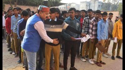 Students being checked before appearing in their UP Board exam at a centre in Pratapgarh on Feb 24. (Sourced)